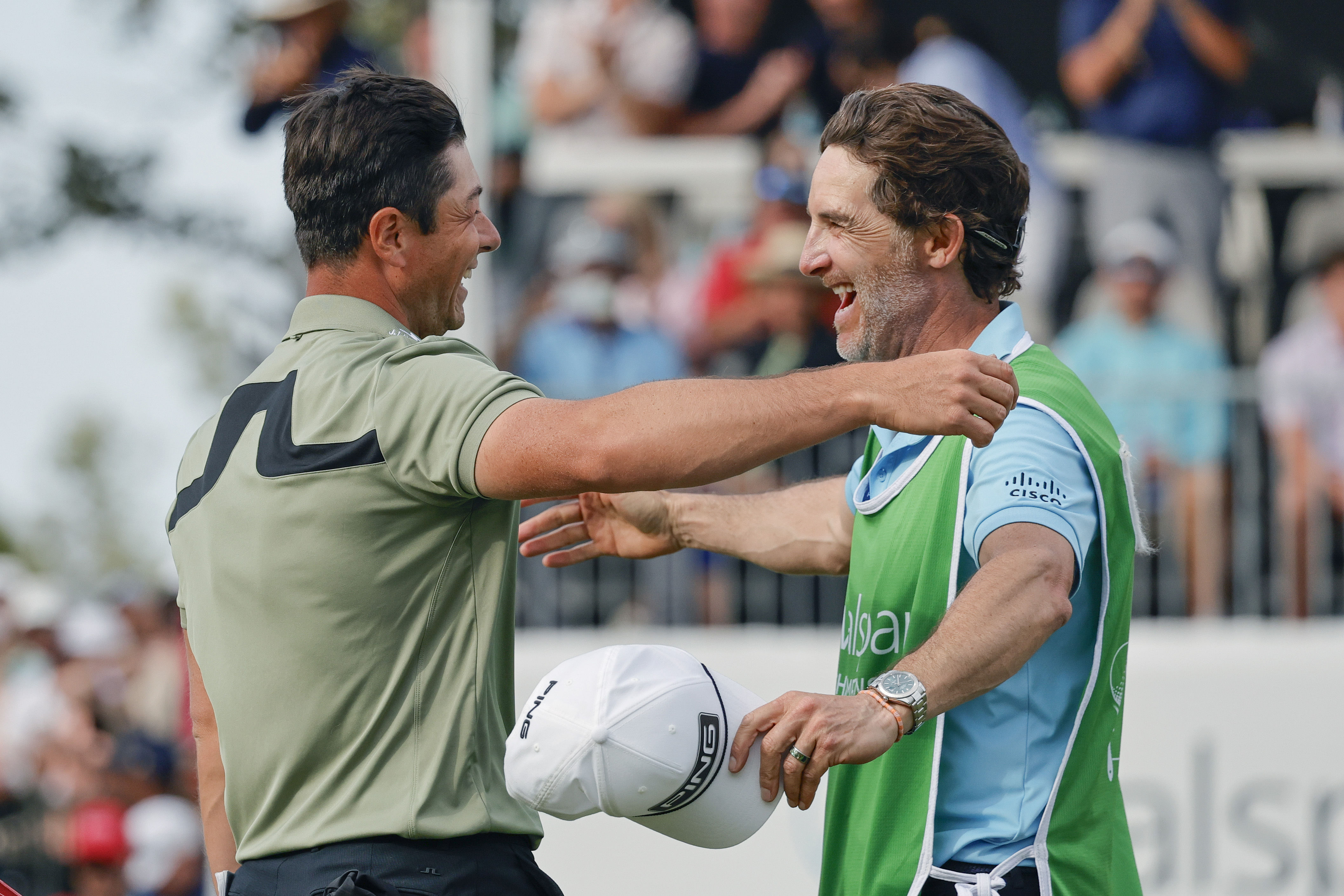 Viktor Hovland (left) and his caddie Shay Knight celebrate winning the Valspar Championship golf tournament at Innisbrook Resort - Source: Imagn